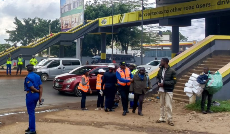 NTSA officers nabbing a pedestrian at Nyayo Roundabout on Tuesday, March 26, 2024.